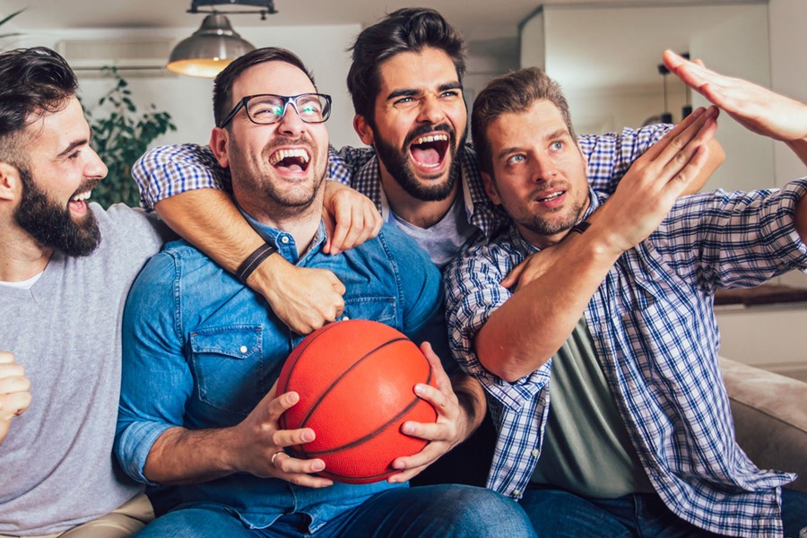 Happy Friends Or Basketball Fans Watching Basketball Game On Tv And Celebrating Victory