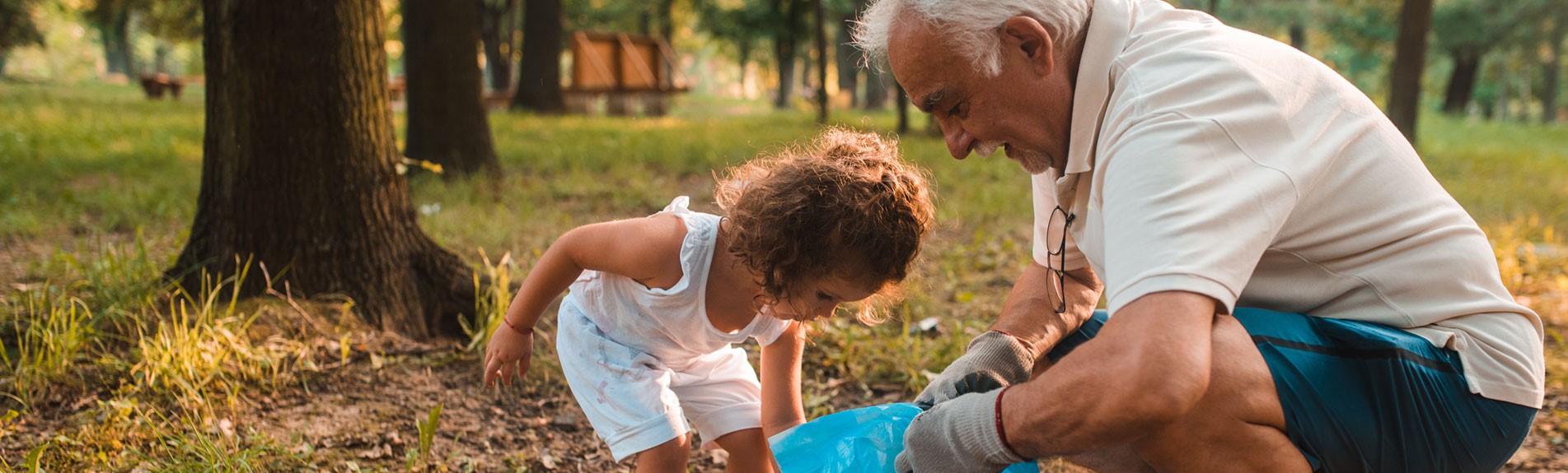 Grandpa And His Granddaughter Keeping The Environment Clean
